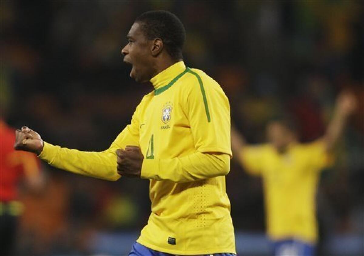 Brazil's Juan celebrates at the end of the World Cup group G soccer match between Brazil and Ivory Coast at Soccer City in Johannesburg, South Africa, Sunday, June 20, 2010. Brazil won 3-1. (AP Photo/Ivan Sekretarev)