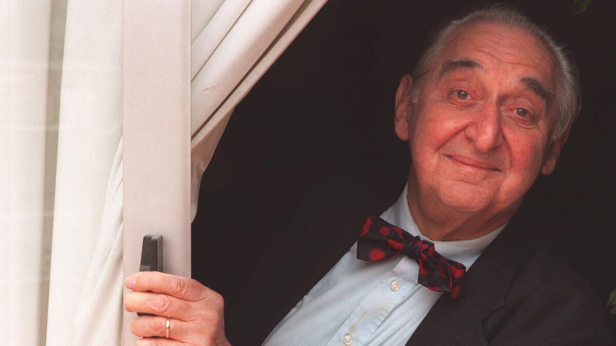 Emmy winner Fyvush Finkel peers through a window at the Radisson Hotel in Los Angeles on May 27, 1995.