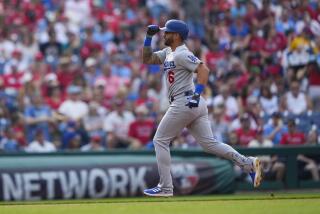 Los Angeles Dodgers' David Peralta runs the bases after hitting a home run off Philadelphia Phillies' Aaron Nola during the fourth inning of a baseball game, Saturday, June 10, 2023, in Philadelphia. (AP Photo/Matt Rourke)
