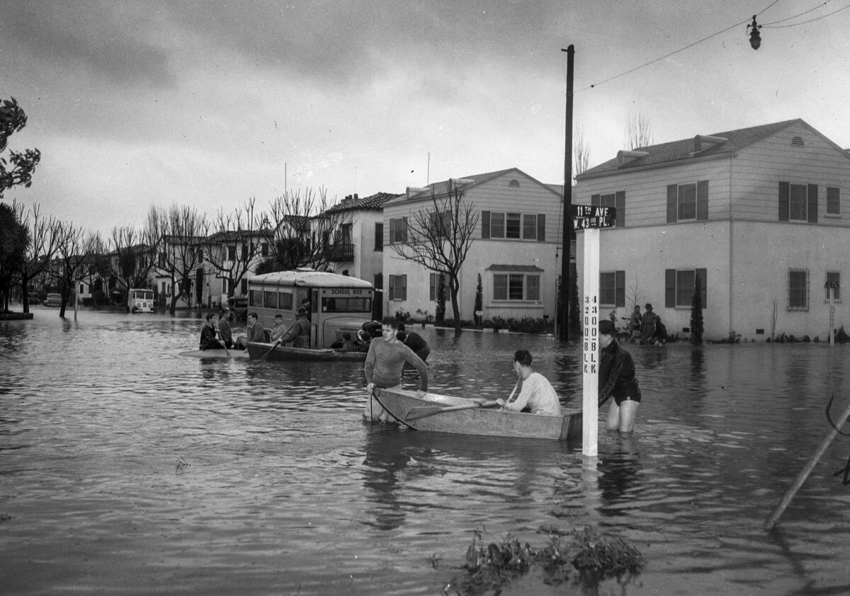 March 2, 1938: Residents use rowboats to get around in flooding at West 43rd Place and 11th Avenue that stranded a school bus.