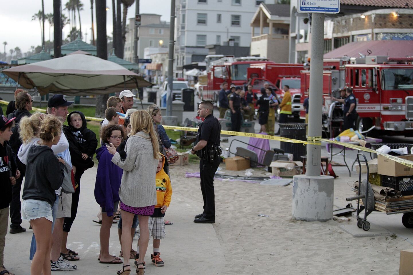 Bystanders, police and firefighters at the scene of the Aug. 3, 2013, incident in which a crowd of pedestrians was struck in Venice Beach.