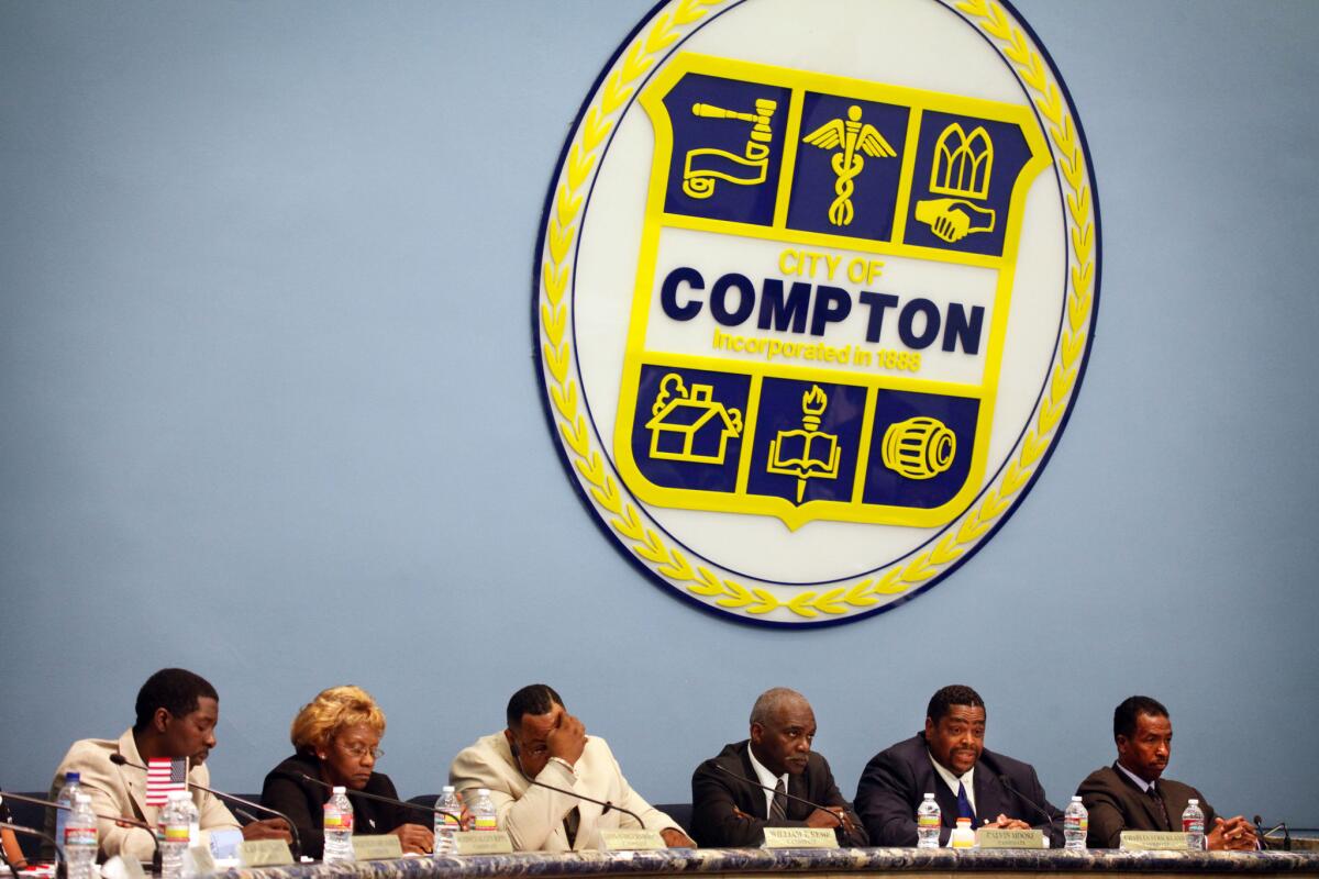 Candidates for Compton mayor appear at a forum earlier this month.