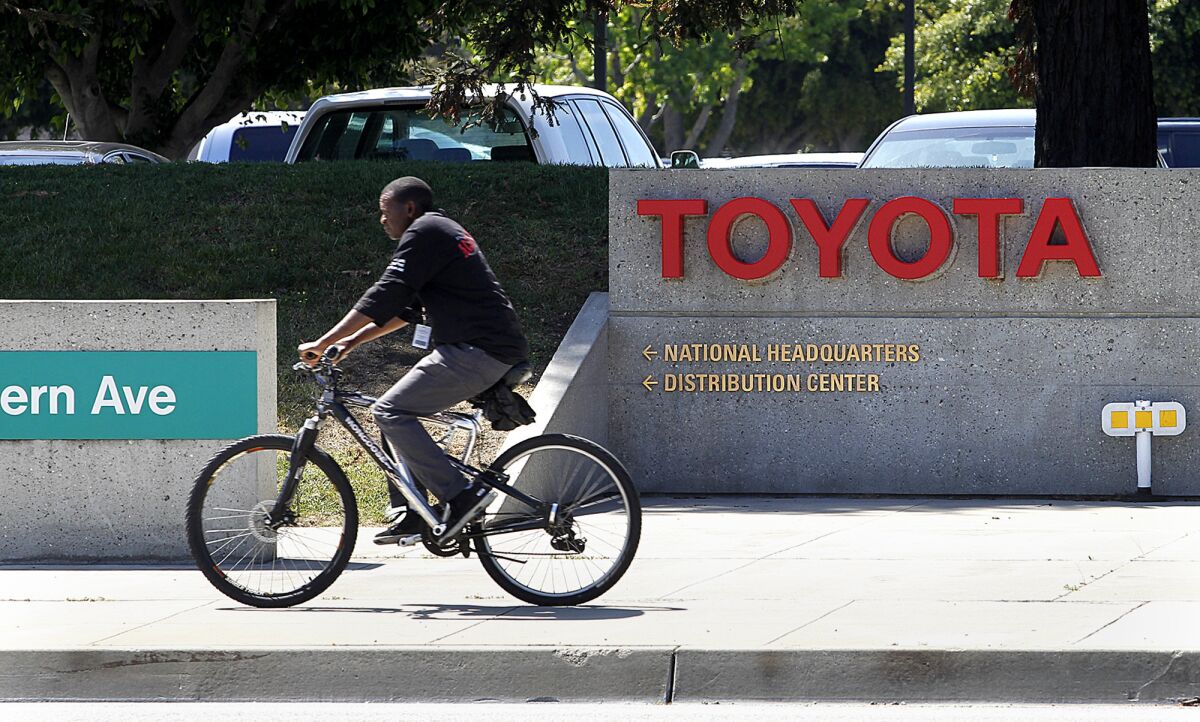 Toyota's U.S. auto financing arm, headquartered in Torrance, has agreed to pay restitution to black and Asian borrowers after federal regulators found those borrowers paid more than whites for their car loans.