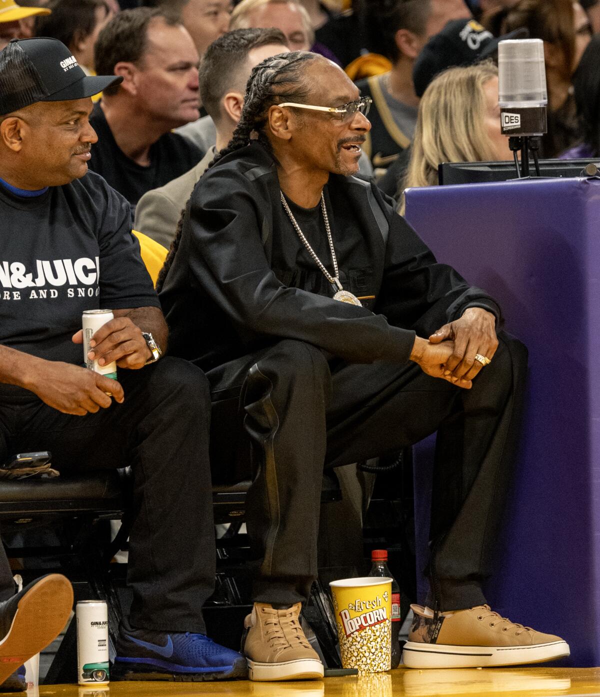 Snoop Dogg sits courtside as the Lakers play the Nuggets 