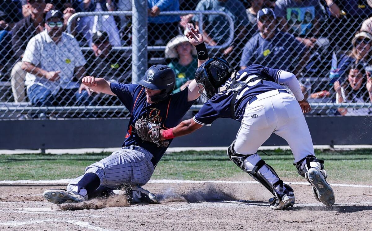 Venice catcher Charlie Nisbet tags out Chatsworth's Micah Klotz at home plate.