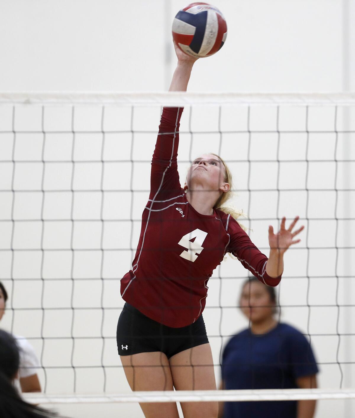 Estancia's Ruby Uchytil (4) spikes the ball in the first set against Bolsa Grande on Tuesday in a nonleague match.