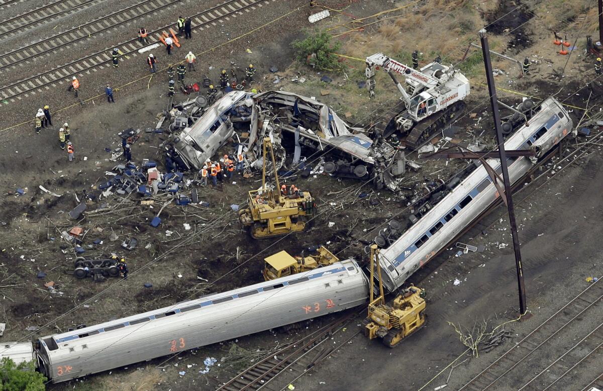 A May 13, 2015, photo of emergency personnel at the scene of the derailment in Philadelphia of an Amtrak train headed to New York.