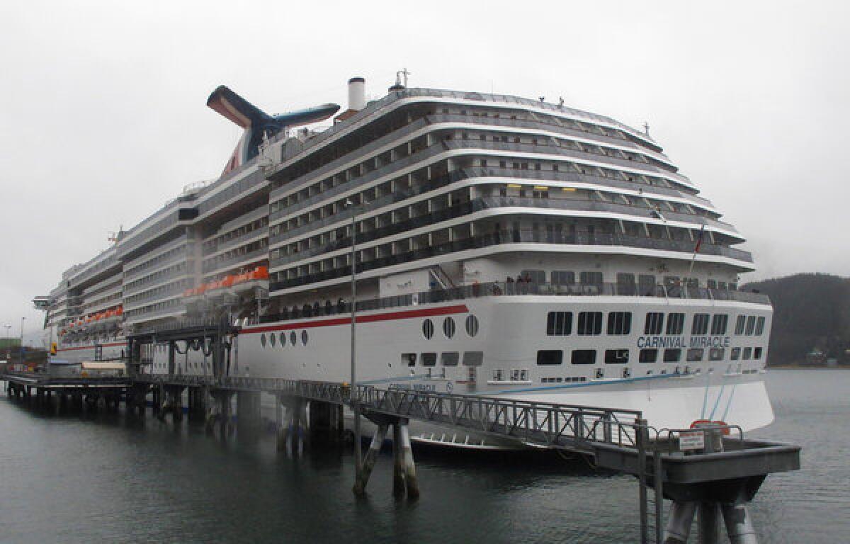 The Carnival Miracle docked in Juneau. Carnival Corp. will install scrubbers to cut sulfur oxide emissions and filters to capture soot from 32 cruise ships over the next three years.