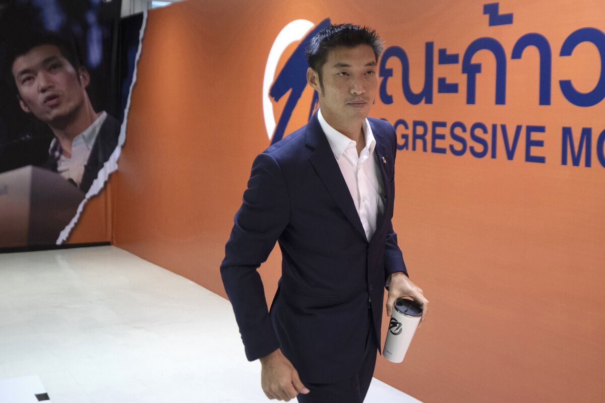 FILE - Former leader of the disbanded Future Forward party Thanathorn Juangroongruangkit leaves a press conference in Bangkok, Thailand on Jan. 21, 2021. Thanathorn has vowed to continue his activities without fear, even though he faces a possible 20 years in prison after being indicted Monday, April 11, 2022, on charges that he insulted the king and violated a law on online activity. (AP Photo/Sakchai Lalit, File)