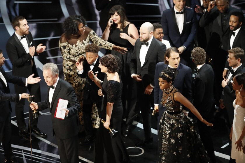 Cast and crew of "Moonlight" and "La La Land" mix onstage at the 2017 Oscars after the wrong film was named best picture. 