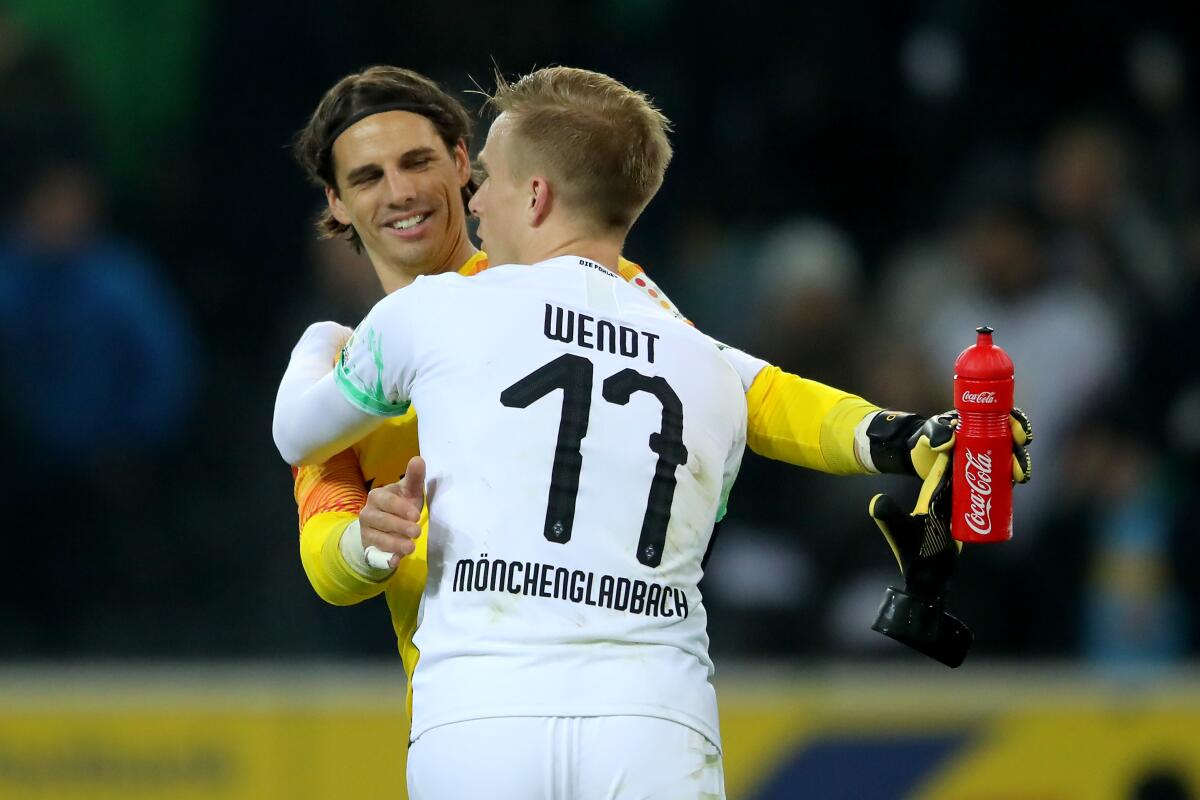 lr Yann Sommer and Oscar Wendt (17) of Moenchengladbach celebrate after beating FSV Mainz 05 on Jan. 25 at Borussia-Park.