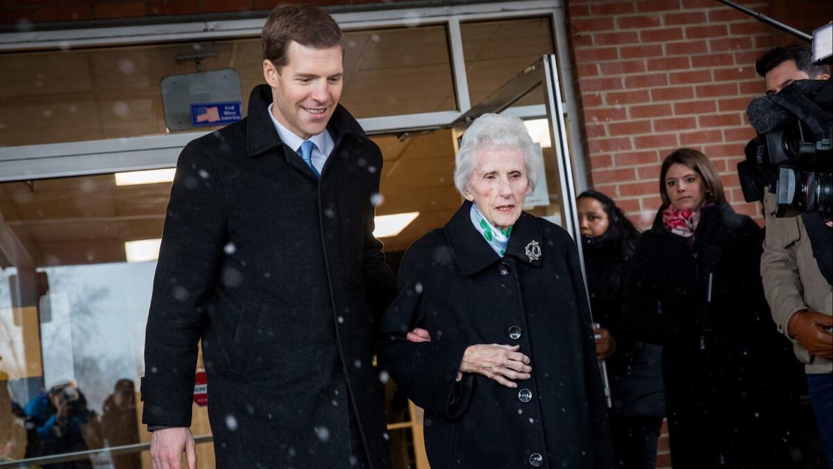 Conor Lamb, Democratic House candidate for Pennsylvania's 18th District, and his grandmother Barbara Lamb exit the polling station in Tuesday's closely watched election.