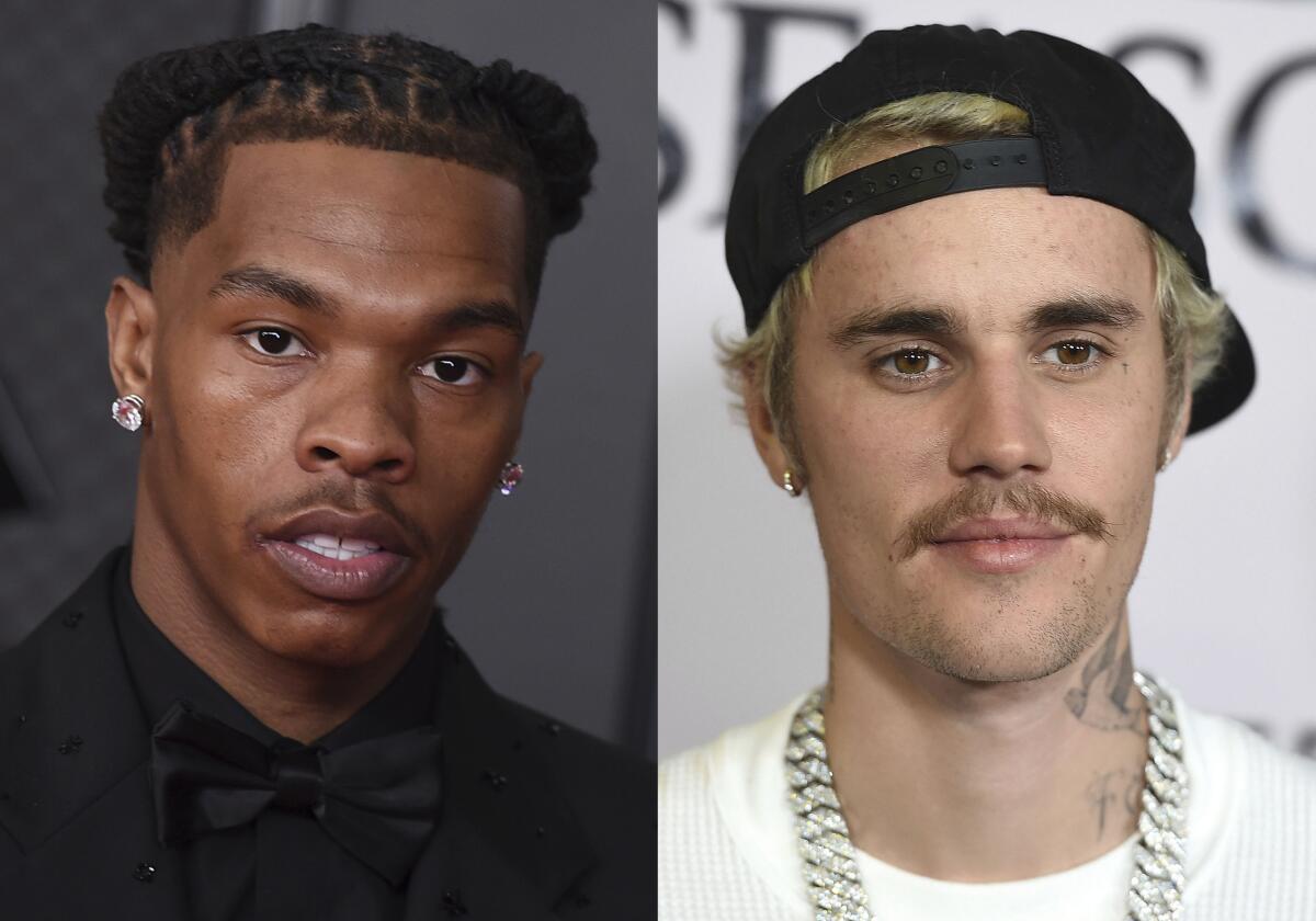 Lil Baby appears in the press room at the 63rd annual Grammy Awards on March 14, 2021in Los Angeles, left, and Justin Bieber appears at the Los Angeles premiere of "Justin Bieber: Seasons" on Jan. 27, 2020. The pair are set to headline Jay-Z's Made in America festival in Philadelphia. Organizers announced Monday that Megan Thee Stallion, Doja Cat, Roddy Ricch, Bobby Shmurda and A$AP Ferg will also perform at the two-day event on Sept. 4-5 over Labor Day Weekend. (Photos by Jordan Strauss/Invision/AP)
