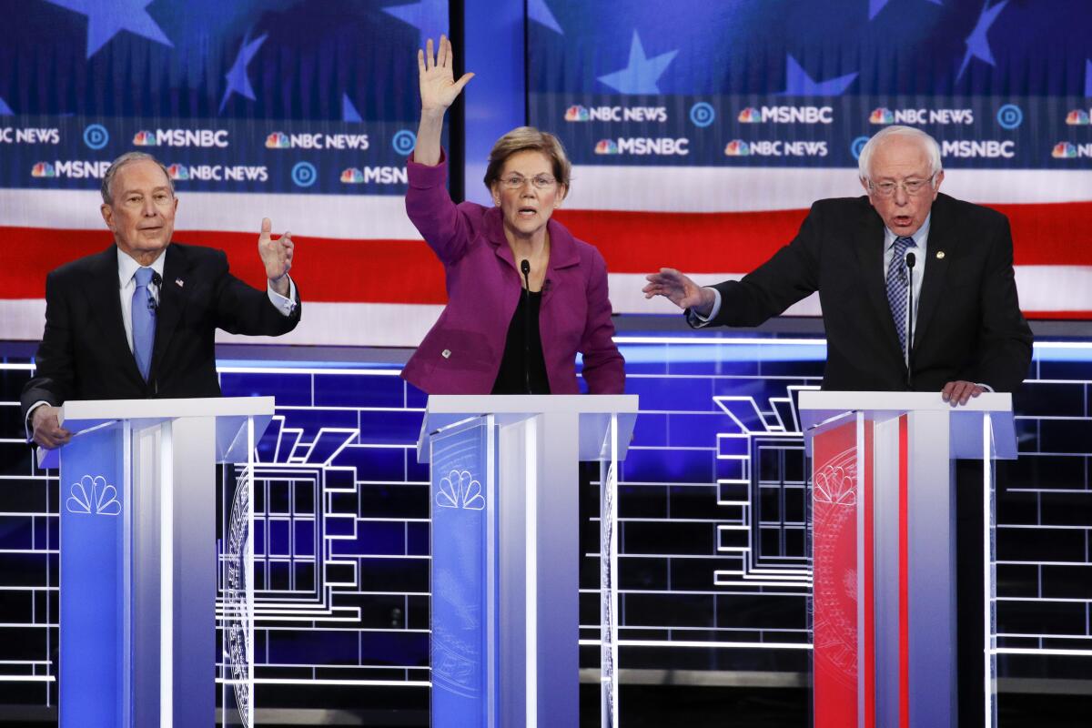 Democratic presidential candidates Mike Bloomberg, left, Elizabeth Warren and Bernie Sanders in Wednesday's debate, which drew 19.7 million viewers for NBC and MSNBC. 