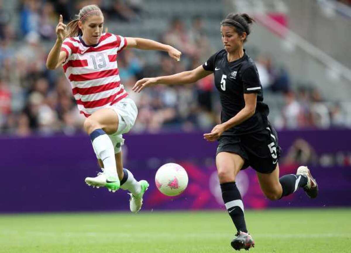 The United States' Alex Morgan, left, vies for the ball with New Zealand's Abby Erceg during their 's quarterfinal soccer match.