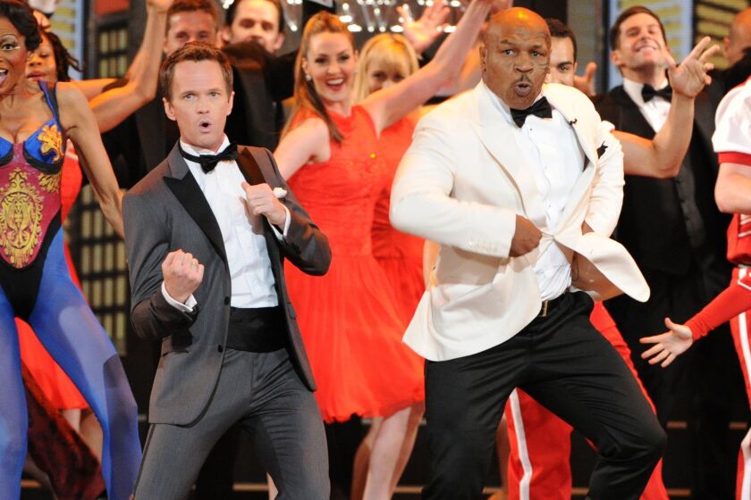 Host Neil Patrick Harris and casts of Broadway shows perform during the big opening number.