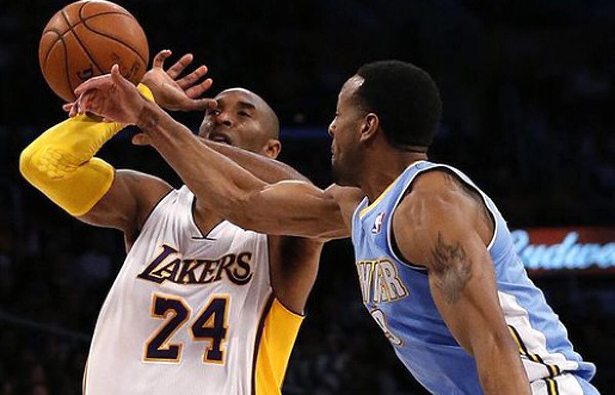 A playoff matchup between Kobe Bryant (24) and the Lakers against Andre Iguodala and the Nuggets would favor Denver, according to former Lakers great Jerry West.
