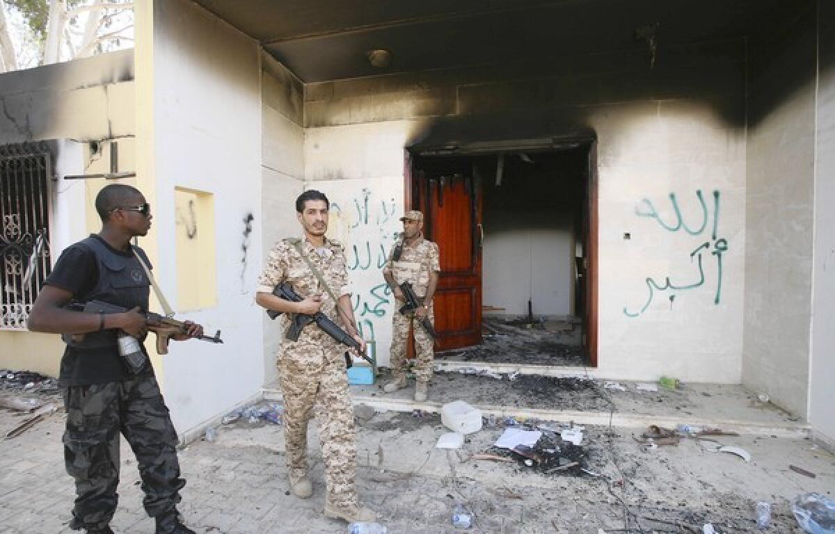 Libyan military guards inspect one of the buildings at the U.S. diplomatic compound in Benghazi three days after the attack that killed four Americans.