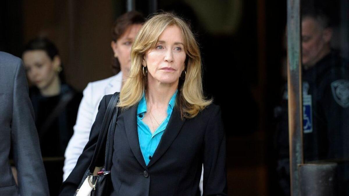 Actress Felicity Huffman leaves the John Joseph Moakley United States Courthouse in Boston this month. She and more than a dozen other parents tied to the college admissions scandal will plead guilty, prosecutors say.