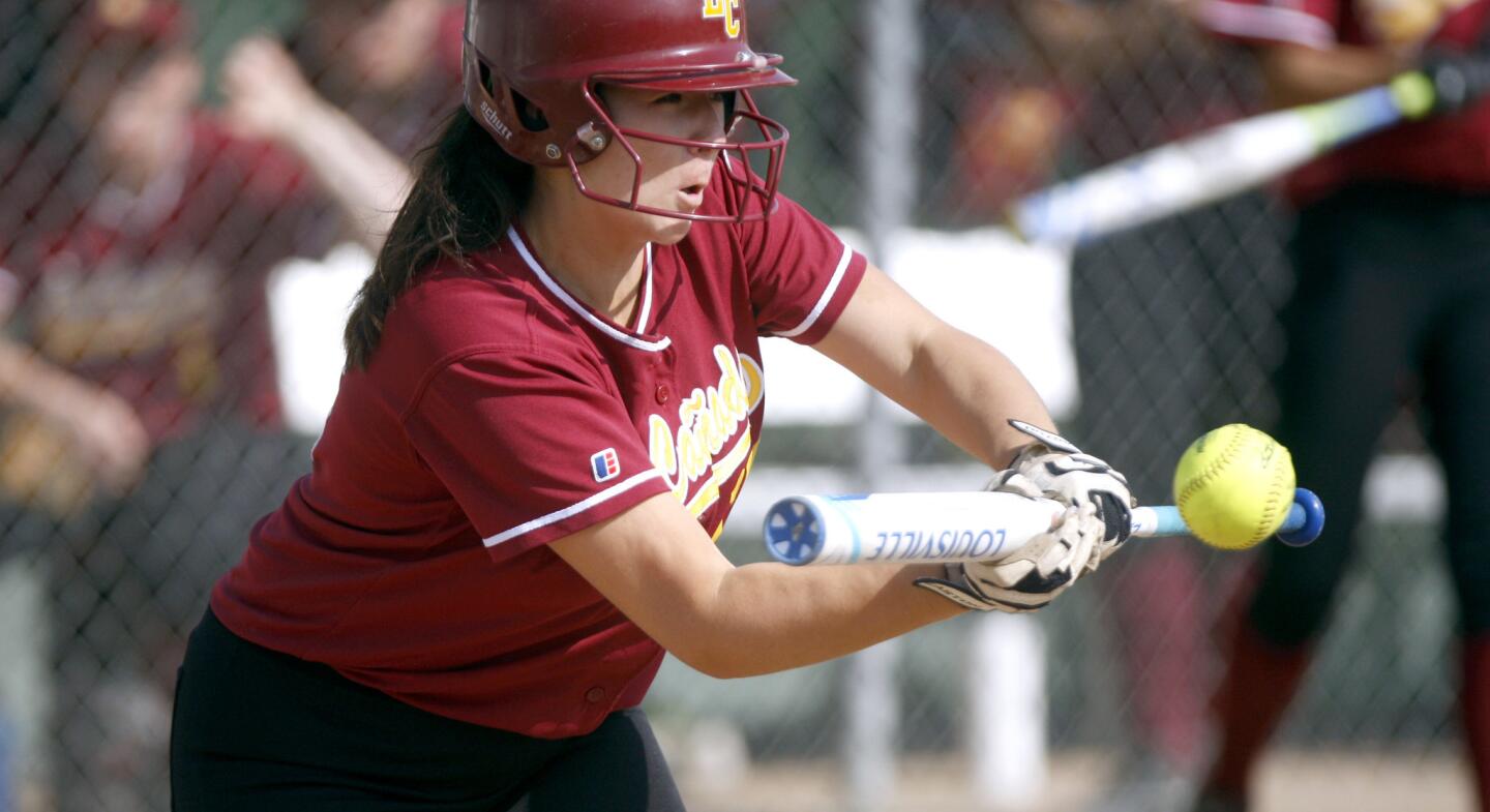 La Cañada High School softball player #12 Abby An lays down a bunt for a hit in game vs. Monrovia High School in Monrovia on Tuesday, April 11, 2017. LCHS won 7-0.