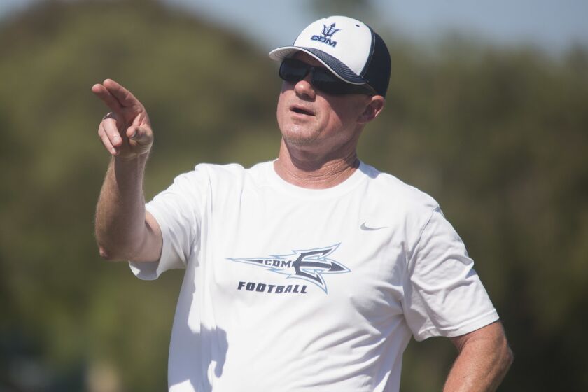 Corona del Mar's head coach Dan O'Shea directs the defense during practice on Thursday, August 17, 2017.