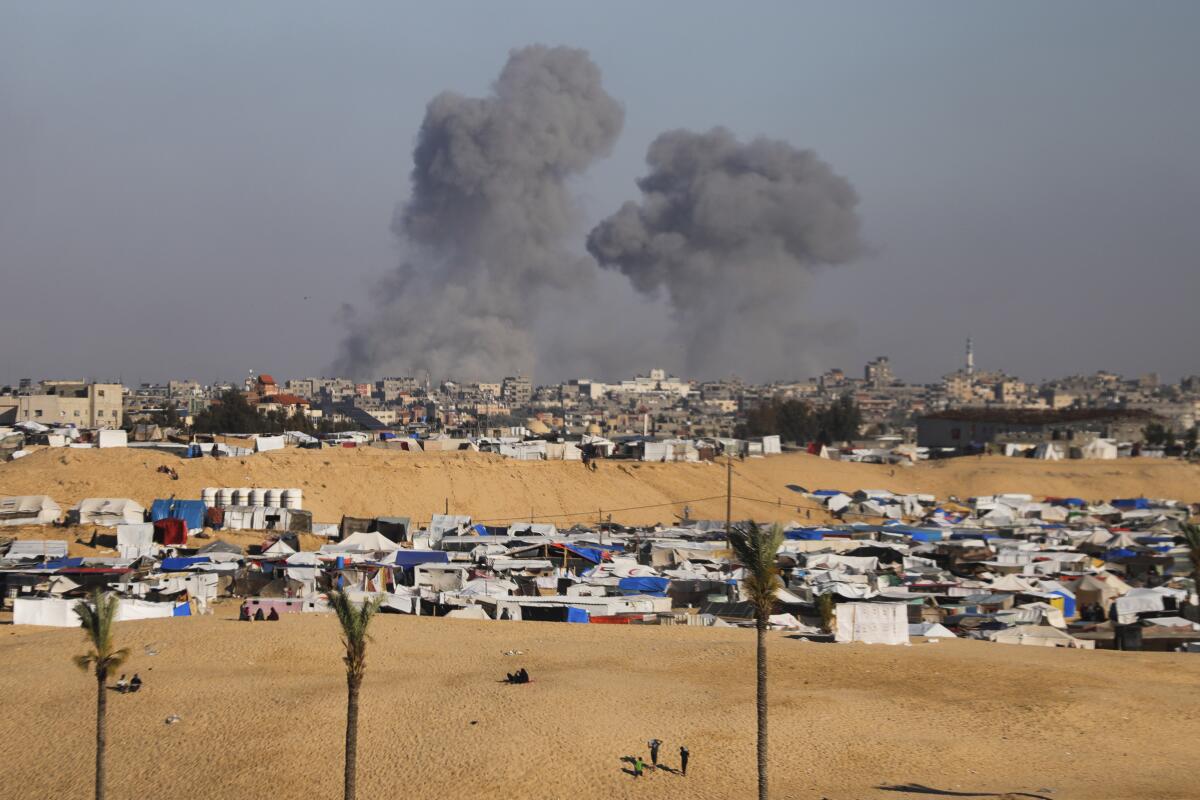 Smoke rises in the distance over the Gaza Strip.