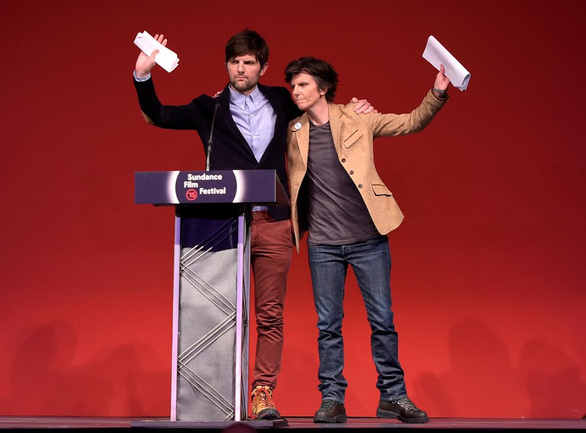 Adam Scott, left, and Tig Notaro speak onstage during the Sundance Film Festival Awards Ceremony.