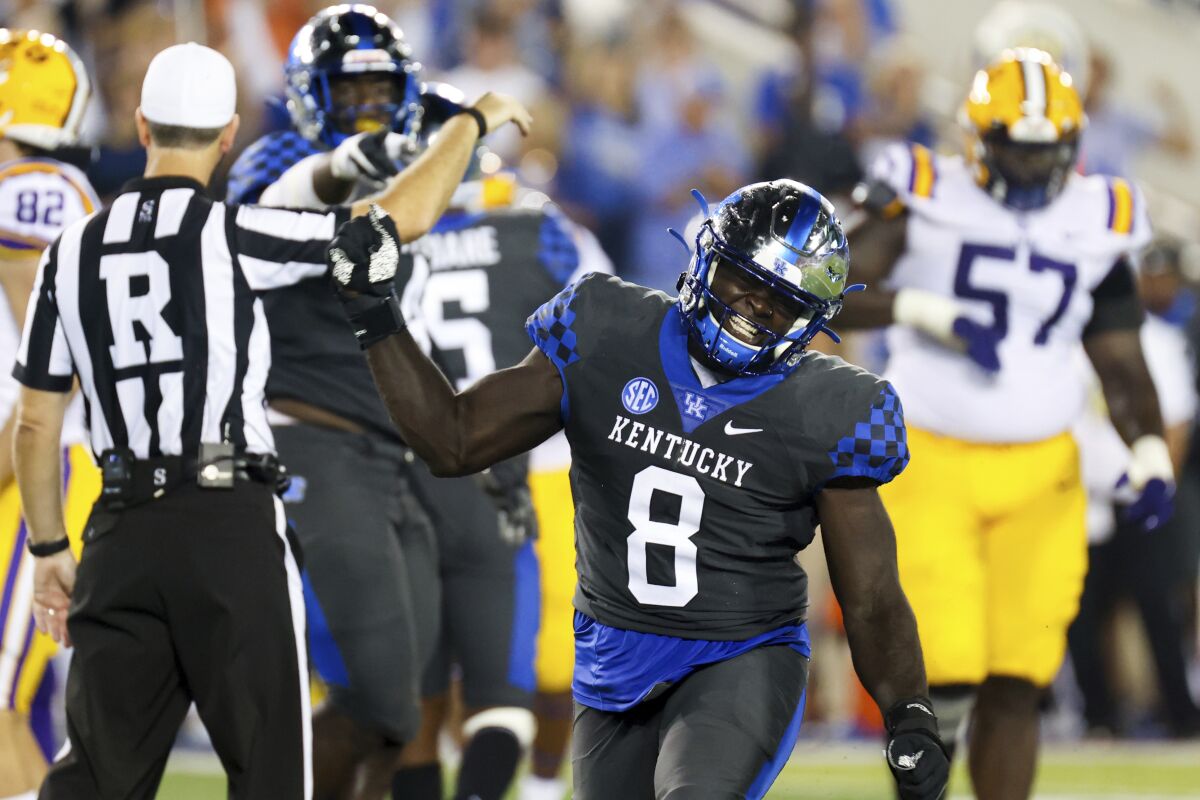 Kentucky defensive tackle Octavious Oxendine (8) celebrates getting a sack during the first half of the team's NCAA college football game against LSU in Lexington, Ky., Saturday, Oct. 9, 2021. (AP Photo/Michael Clubb)