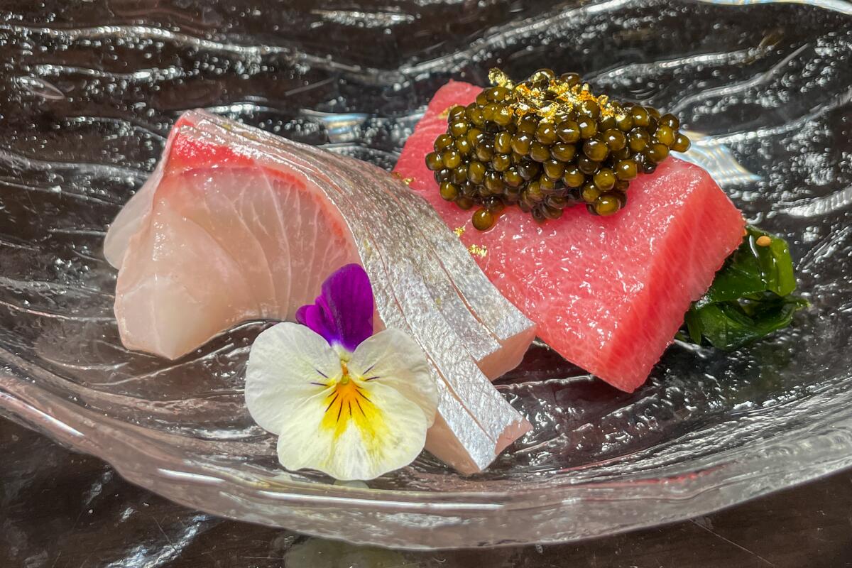 Sushi with caviar and edible flowers are part of the Omakase at Wakuda at the Venetian
