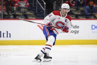 Montreal Canadiens center Nick Suzuki (14) in action during the second period of an NHL hockey game against the Washington Capitals, Tuesday, Feb. 6, 2024, in Washington. (AP Photo/Nick Wass)