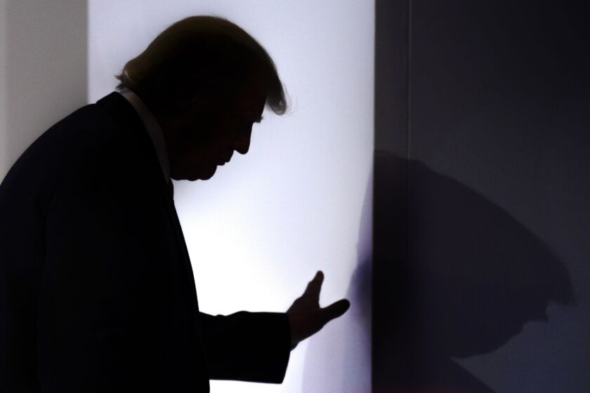 U.S. President Donald Trump leaves the stage after addressing a plenary session on the last day of the annual meeting of the World Economic Forum, WEF, in Davos, Switzerland, Friday, Jan. 26, 2018. (Laurent Gillieron/Keystone via AP)