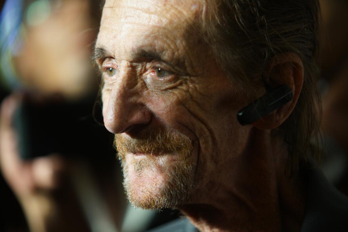 A close-up of a man with a weathered face.