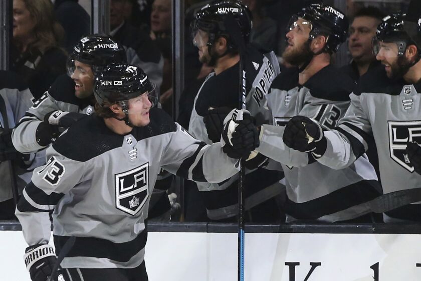 Los Angeles Kings center Tyler Toffoli, left, celebrates with teammates after scoring against the Calgary Flames during the first period of an NHL hockey game in Los Angeles, Saturday, Oct. 19, 2019. (AP Photo/Alex Gallardo)