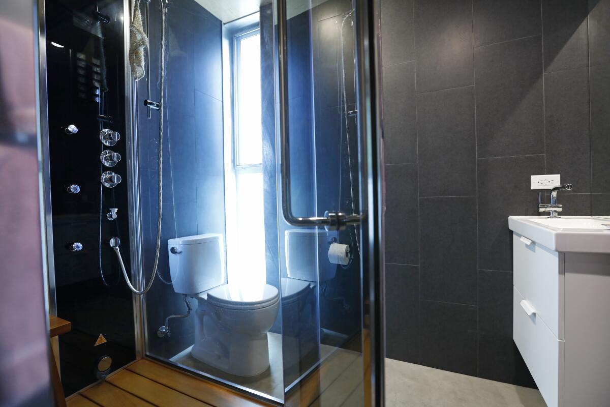 A toilet and steam shower-sauna.