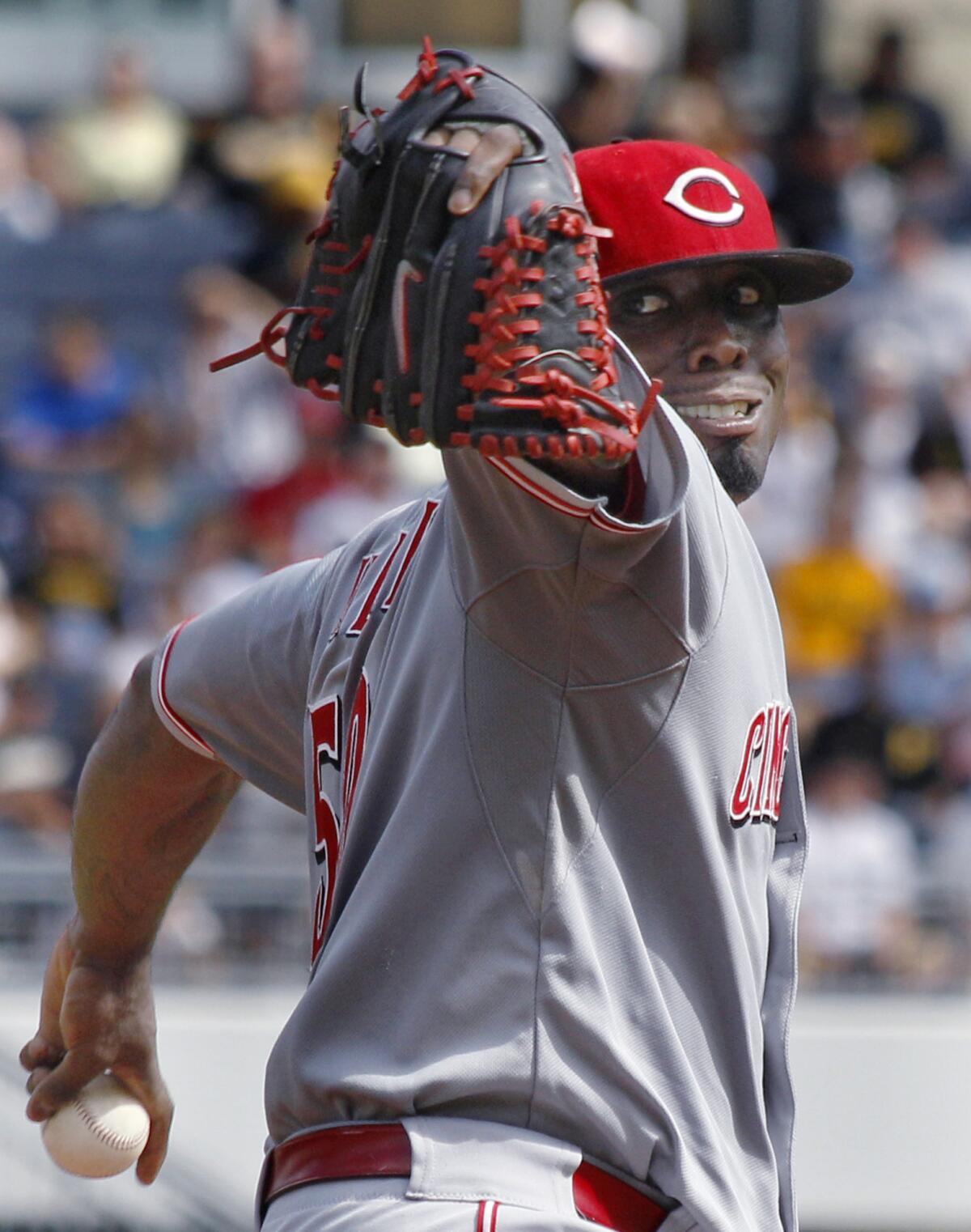 Cincinnati Reds starting pitcher Dontrelle Willis winds up against the Pittsburgh Pirates in the first inning.