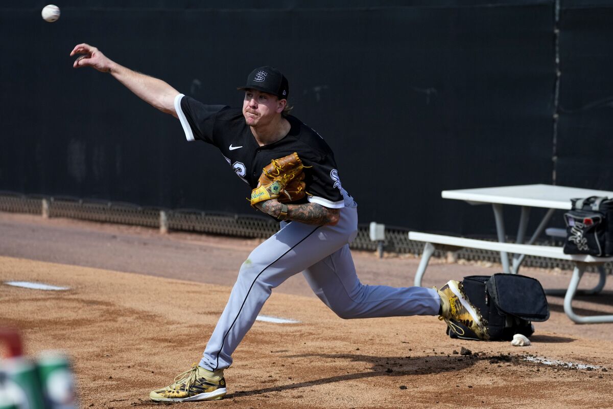 Chicago White Sox pitcher Mike Clevinger throws during an MLB spring training baseball practice.