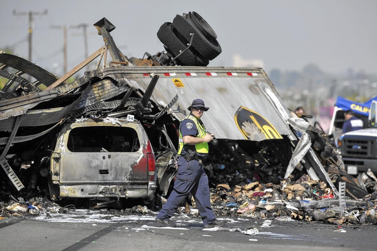California Highway Patrol investigators at the scene of a fiery crash Feb. 27 on the 5 Freeway in the City of Commerce.
