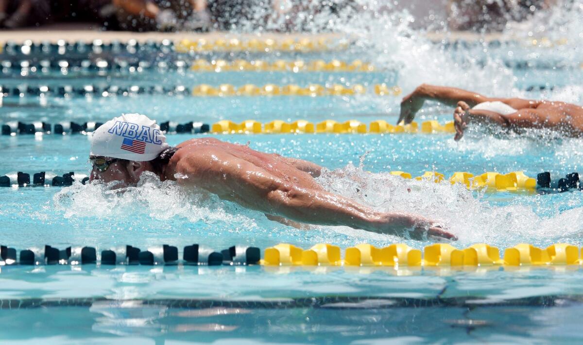 Michael Phelps competes in the 100-meter butterfly.