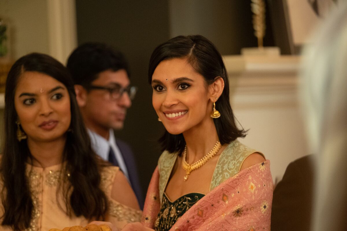 A smiling young woman in the movie “India Sweets and Spices.”