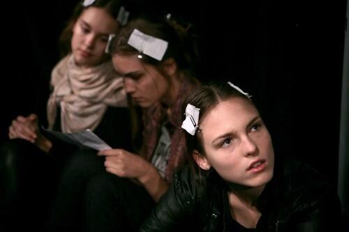 Models Paulina Nienoozik, left, from Poland, Julija Steponaviciute, center, from Lithuania and Polina Sova from Norway wait backstage to dress for the Spring 2010 fashion collection from Cynthia Steffe by designer Shaun Kearney.
