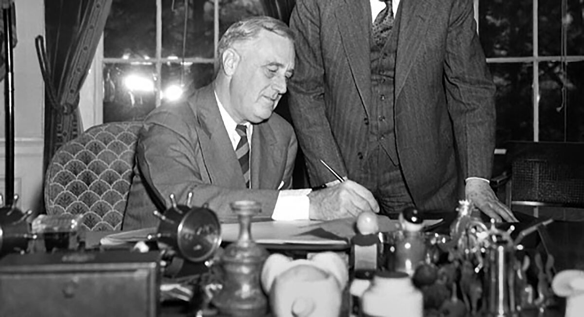 President Franklin D. Roosevelt signs the Works Progress Administration into law  on May 6, 1935.