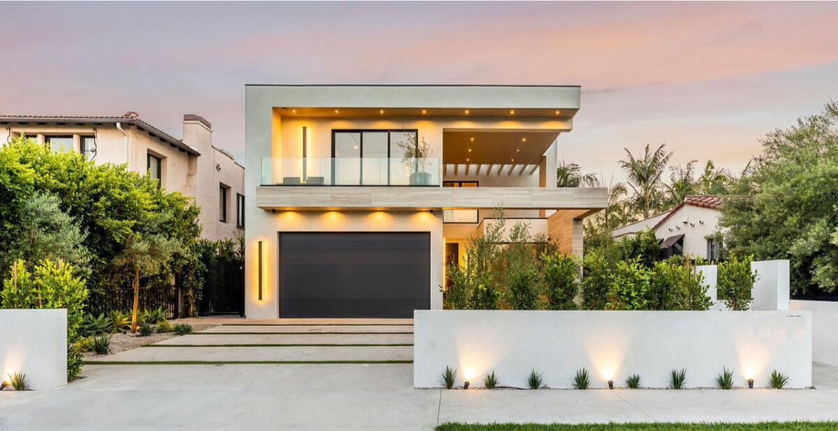 This modern home in Beverly Grove is listed by Edan Amar for $6 million.
