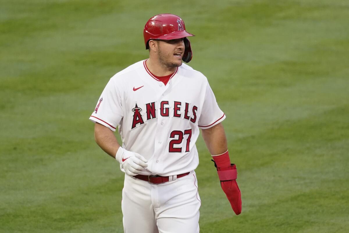 Angels center fielder Mike Trout walks back to first base during a game against Cleveland on May 17.