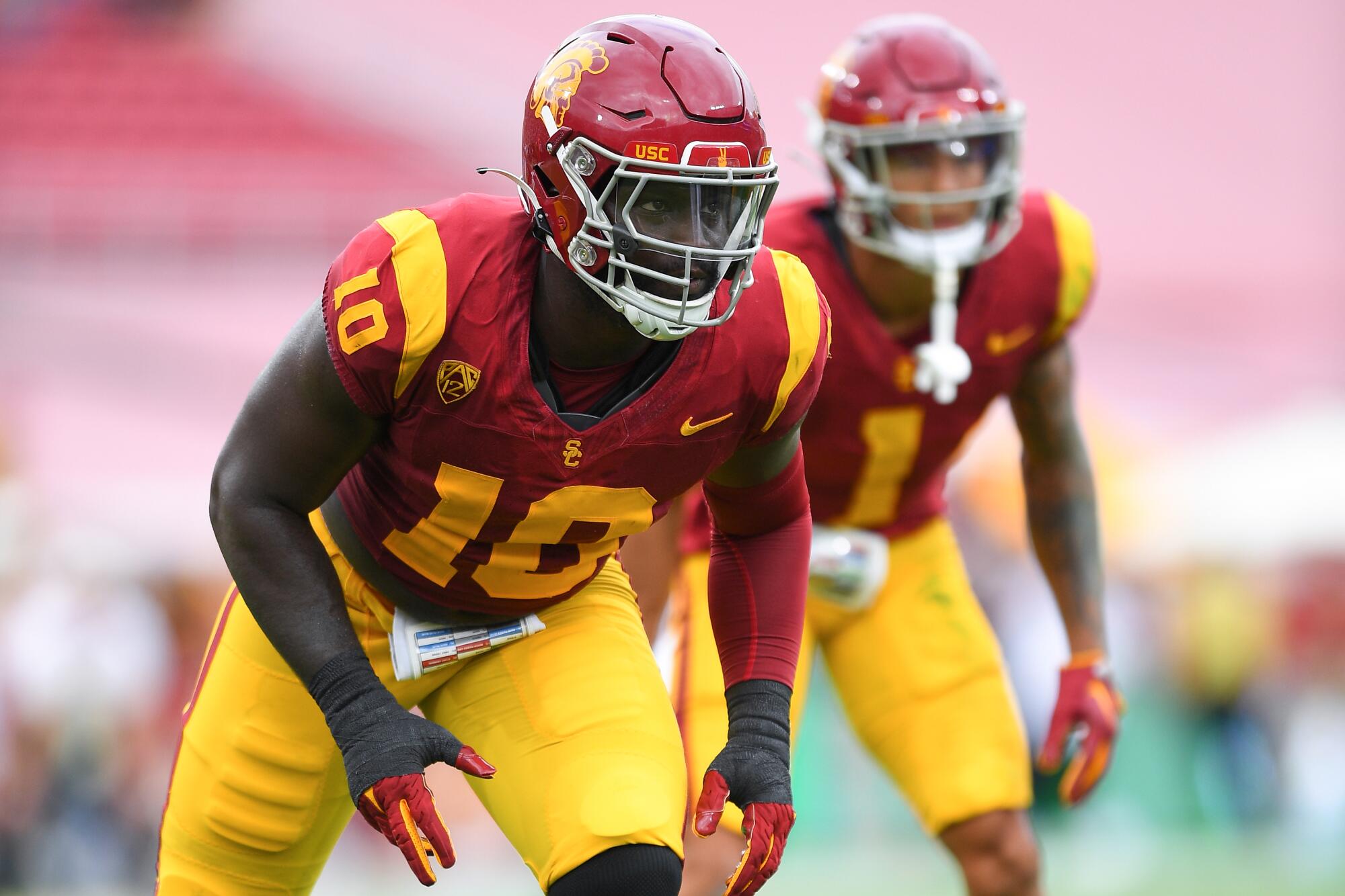 USC rush end Jamil Muhammad readies for a snap against Nevada at the Coliseum on Sept. 2.