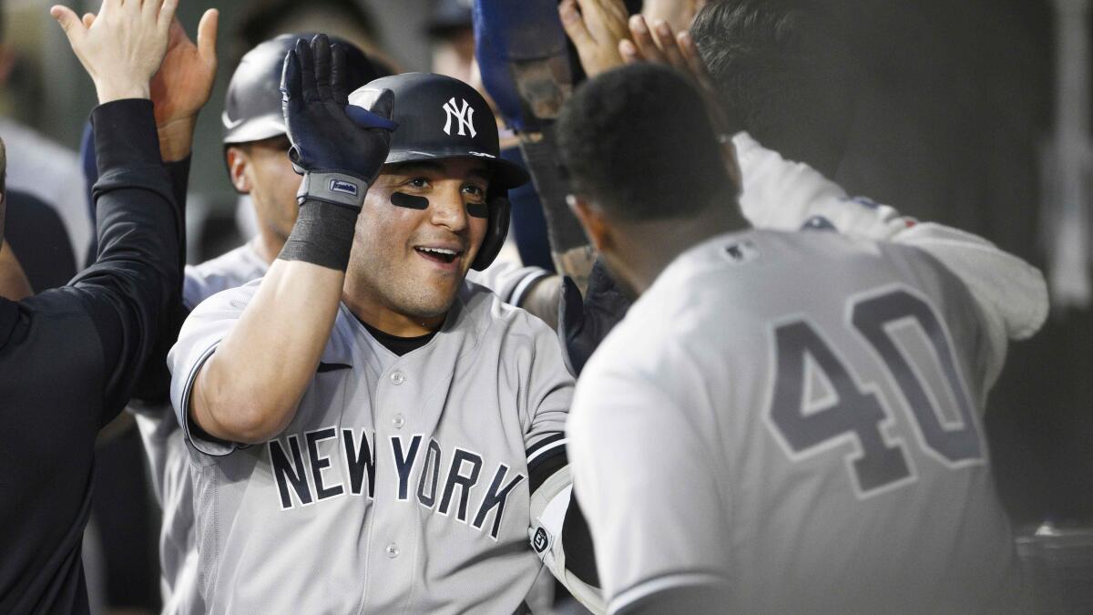 Cano's grand slam, 6 RBIs propel Yankees past Tigers