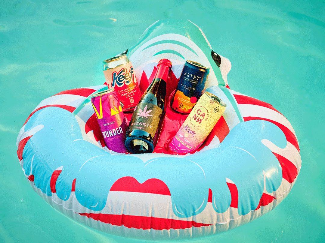 Five cannabis-infused beverages sitting in a pool floatie and rocking gently.