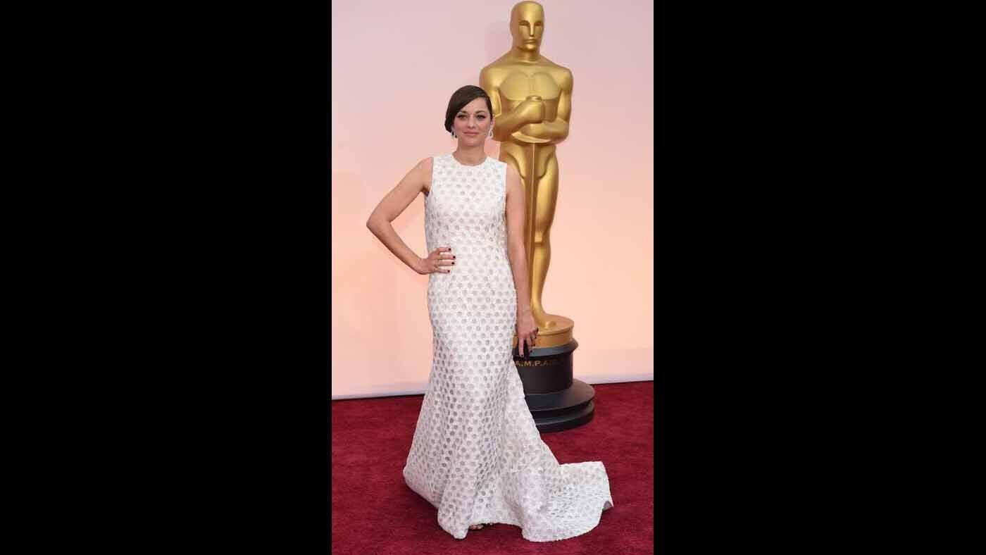 Nominee Marion Cotillard donned this off-white silk creation by Christian Dior for the 2015 Oscars.