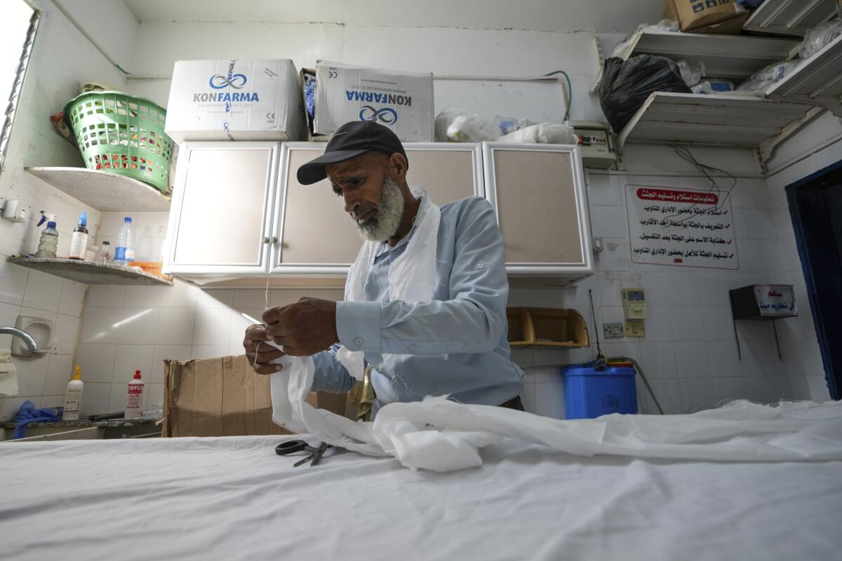 A man in a lab or medical room.