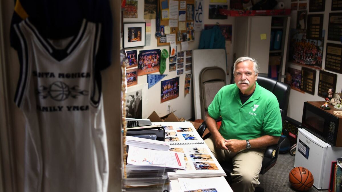 Longtime USC announcer Peter Arbogast in his office at the Santa Monica YMCA where he is a youth sports coordinator.