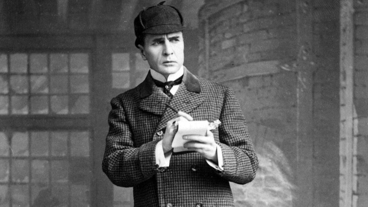 Actor William Gillette plays detective Sherlock Holmes in 1899.